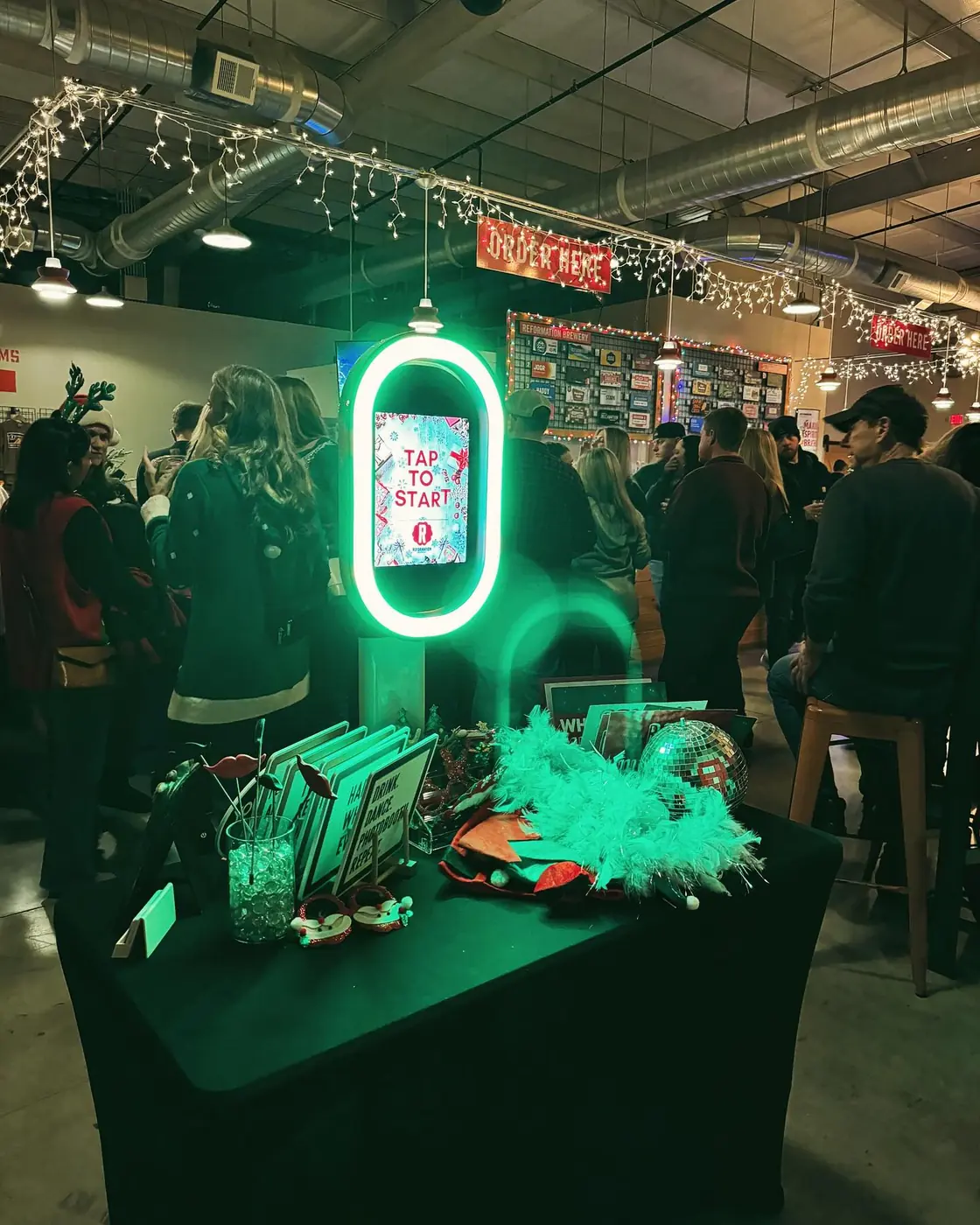 Glowing ring-light photo booth at a brewery holiday party